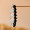 Black Obsidian, White Crystal, and Aquamarine Beaded Bracelet